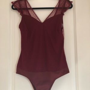 Cap sleeve lace bodysuit.